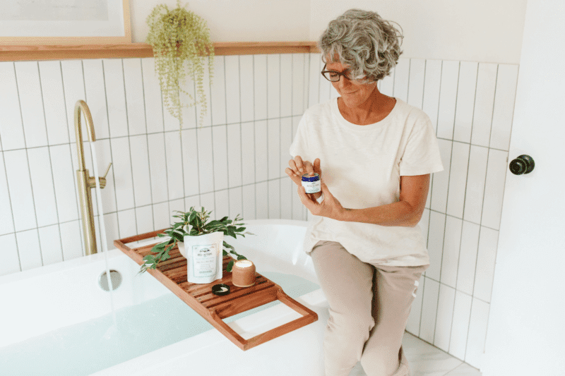 A woman using Pure CBD Cream